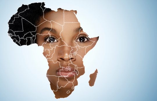 Face of young african woman inside the map of Africa